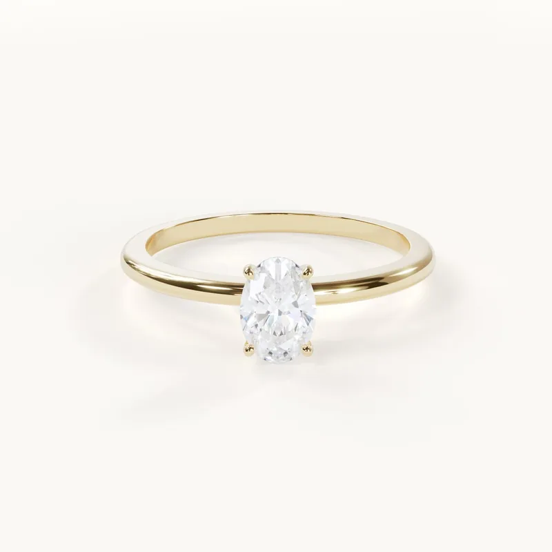 Elegance Petite, a delicate oval solitaire ring in yellow gold