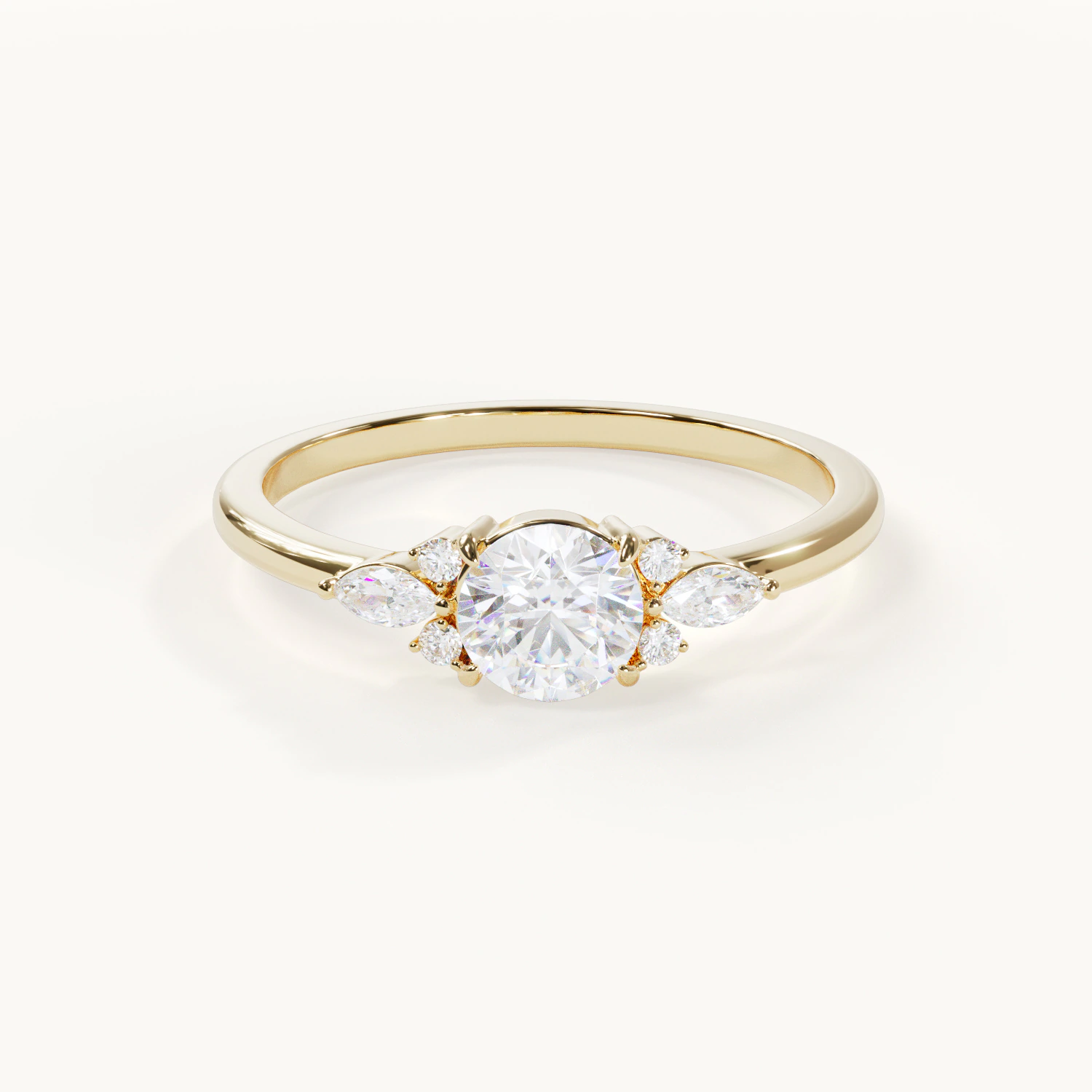 Muse Lumière Brilliant Engagement Ring with a 0.5-ct. round center stone and marquise-cut side stones in yellow gold – Front view