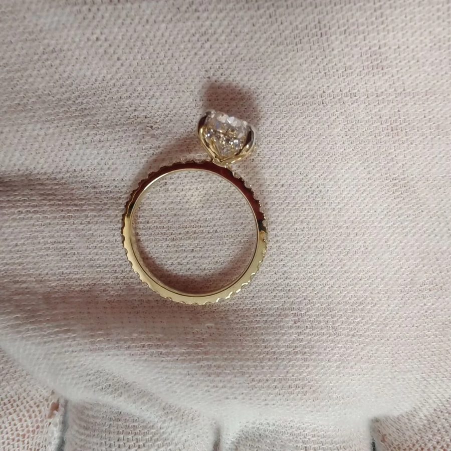 Custom engagement ring with a pavé band and delicate diamond setting by Velur