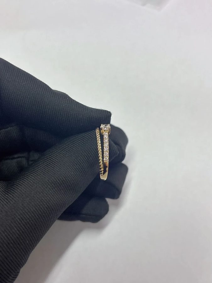 Custom engagement ring with an infinity band and a personalised design by Velur