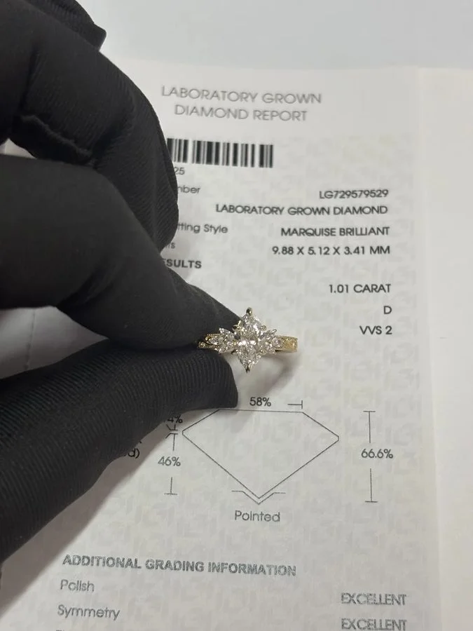 Custom-made marquise engagement ring with a cathedral setting by Velur