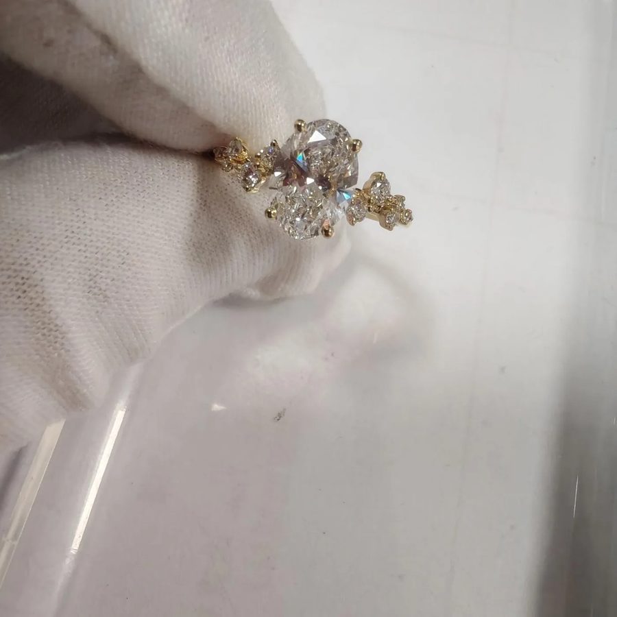 Custom-made oval engagement ring with organic details and a hidden birthstone by Velur