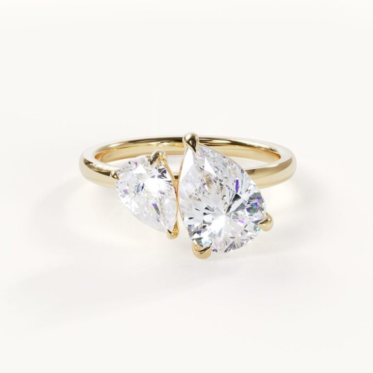 Amélie Toi et Moi-ring in geelgoud met twee druppelvormige stenen en een slanke ringband
