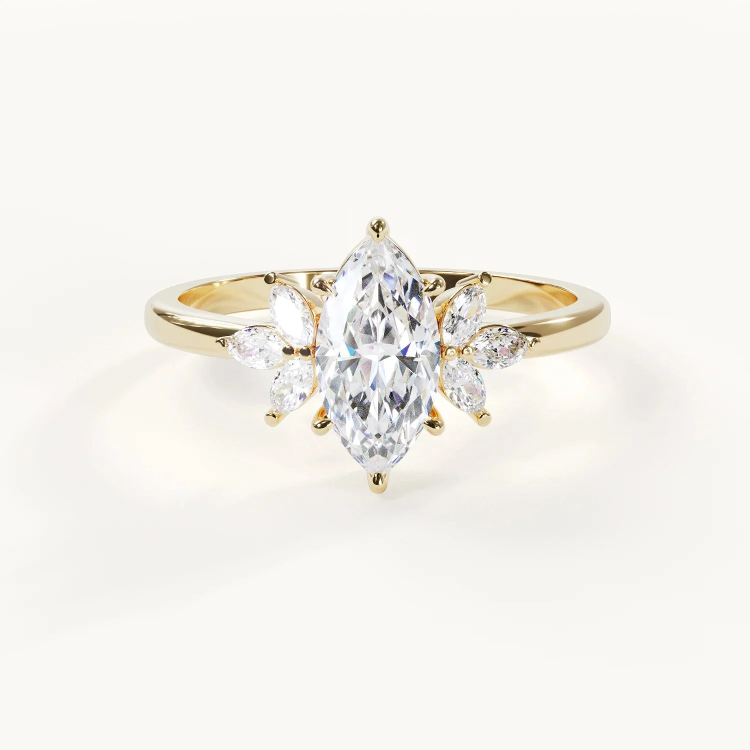Auréline Marquise Engagement Ring in yellow gold with floral accent stones and a slender band