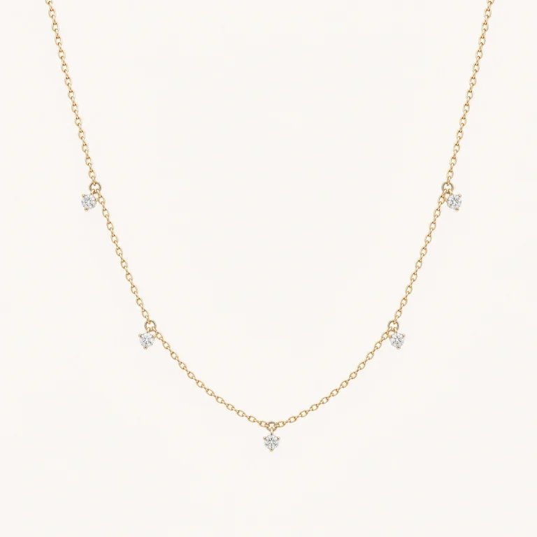 Five Diamonds – Lab-grown diamond necklace in 14K yellow gold on a light background